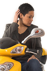 Image showing woman riding electric scooter with no helmet