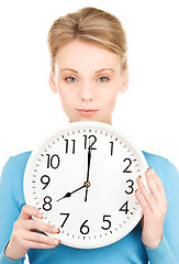 Image showing woman holding big clock