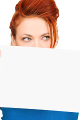 Image showing redhead woman with blank board