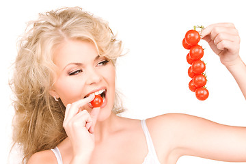 Image showing young beautiful woman with ripe tomatoes