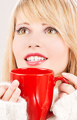 Image showing happy teenage girl with red mug