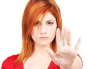 Image showing lovely woman showing stop sign