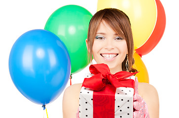 Image showing party girl with balloons and gift box