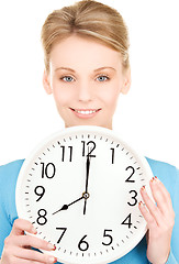 Image showing woman holding big clock