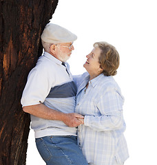 Image showing Happy Senior Couple Leaning Against Tree on White