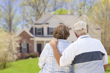 Image showing Happy Senior Couple Looking at Front of House