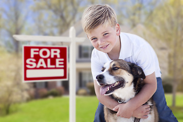 Image showing Young Boy and His Dog in Front of For Sale Sign and House