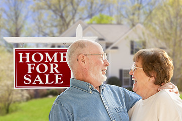 Image showing Happy Senior Couple Front of For Sale Sign and House