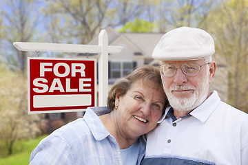 Image showing Happy Senior Couple Front of For Sale Sign and House