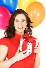 Image showing woman with gift box and balloons