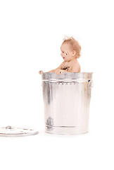 Image showing baby in trash can