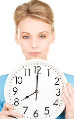 Image showing woman holding big clock