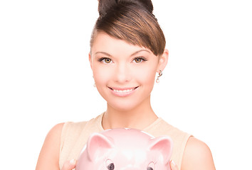 Image showing lovely woman with piggy bank