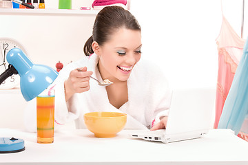 Image showing eating woman laptop computer