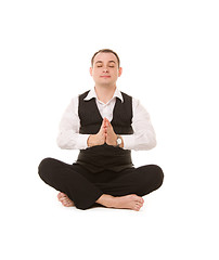 Image showing businessman sitting in lotus pose