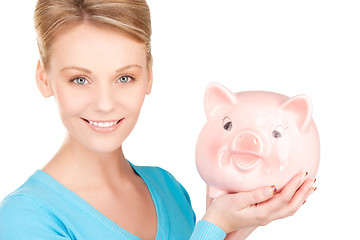 Image showing lovely woman with piggy bank