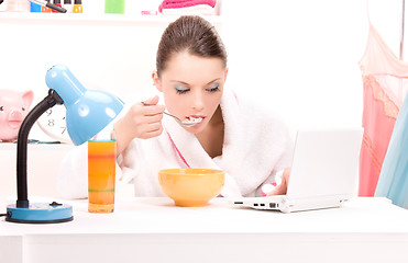 Image showing eating woman laptop computer