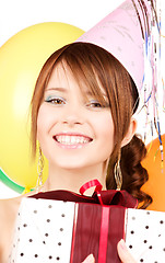 Image showing party girl with balloons and gift box