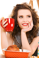 Image showing young attractive woman in the kitchen