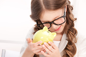 Image showing little girl with piggy bank