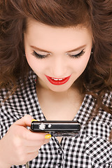 Image showing happy teenage girl with digital camera