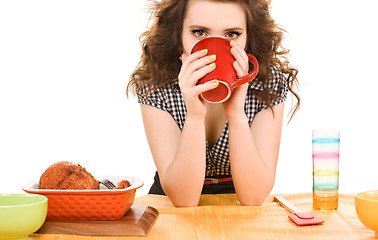 Image showing young attractive woman in the kitchen