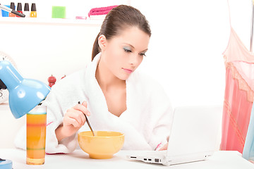 Image showing eating woman laptop computer