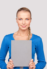 Image showing happy woman with blank board 