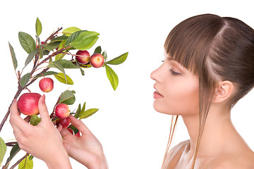 Image showing lovely woman with apple twig