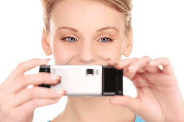 Image showing happy woman using phone camera