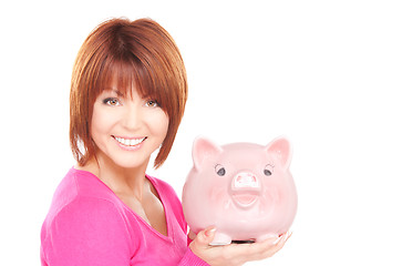 Image showing lovely woman with piggy bank  