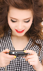 Image showing happy teenage girl with digital camera