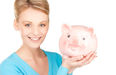 Image showing lovely woman with piggy bank