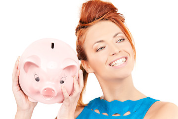 Image showing lovely woman with piggy bank