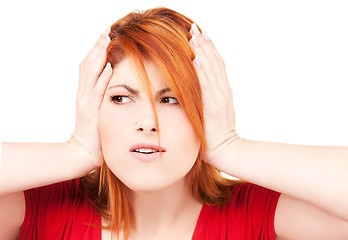 Image showing unhappy redhead woman