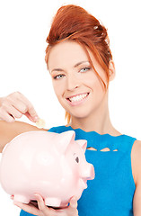 Image showing lovely woman with piggy bank