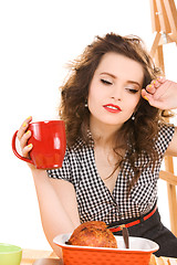 Image showing young attractive woman in the kitchen