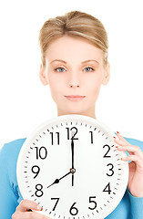 Image showing woman holding big clock