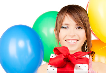 Image showing party girl with balloons and gift box