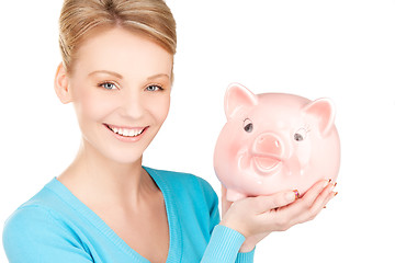 Image showing lovely woman with piggy bank
