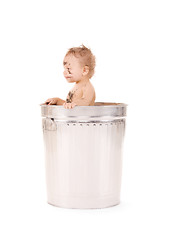 Image showing baby in trash can