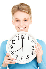 Image showing woman holding big clock