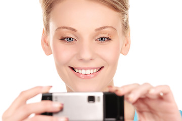 Image showing happy woman using phone camera