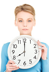 Image showing woman holding big clock