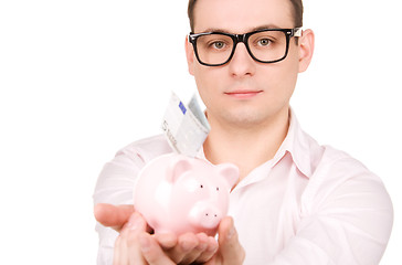 Image showing businessman with piggy bank and money