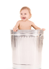 Image showing baby in trash can