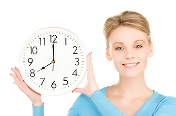 Image showing woman holding big clock