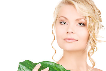 Image showing woman with green leaf