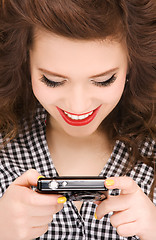 Image showing happy teenage girl with digital camera