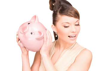 Image showing lovely woman with piggy bank